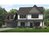 Two-story house with gray and white siding, stone accents, and a two-car garage at 23 Pomegranate Ct, Cameron, NC 28326