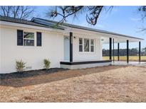 Newly renovated ranch home features a covered porch and spacious yard at 231 Faith Church Rd, Four Oaks, NC 27524