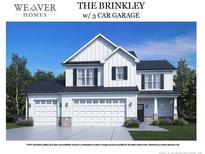 Two-story home featuring a three-car garage, white siding, black shutters, and a covered front entry at 290 Thistle Ct, Sanford, NC 27332