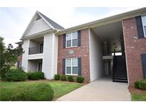A lovely two-story condo with a combination of brick and siding exterior at 159 Gallery Dr # 201, Spring Lake, NC 28390