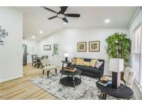Bright living room with ceiling fan, modern furniture and neutral decor create an inviting and relaxing atmosphere at 5802 Lillie Dr, Durham, NC 27712