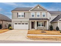 Charming two-story home featuring a two-car garage and well-maintained landscaping at 1029 Bellewood Park Dr, Angier, NC 27501