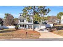 Charming two-story home with a well-maintained lawn and a two-car attached garage at 126 Ribbon Oak Court Ct, Sanford, NC 27332