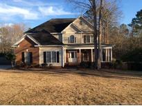 Charming two-story home with brick and vinyl siding and covered porch at 1508 Westfall Cir, Sanford, NC 27330