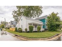 Charming two-story home with a covered front porch and well-maintained lawn on a corner lot at 1512 Pender St, Raleigh, NC 27610