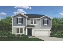 Charming two-story home with a two-car garage, attractive shutters, and a well-manicured lawn at 5554 Swanns Station Rd, Sanford, NC 27332