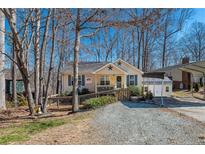 Charming single-story home with a welcoming front porch and well-maintained yard at 4901 North Pointe, Sanford, NC 27332