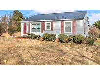 Charming single-story home with tidy front yard and covered entrance at 2613 Watson Ave, Sanford, NC 27332