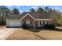 Charming one-story home with a brick and siding exterior and well-maintained lawn at 59 Claymore Ct, Broadway, NC 27505