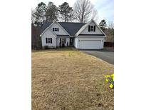 Charming single-Gathering home featuring a two-car garage and well-maintained landscaping at 124 Brookfield Cir, Sanford, NC 27330