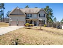 Charming two-story home with a two-car garage and a well-maintained front yard at 85 Clearview Ct, Sanford, NC 27332