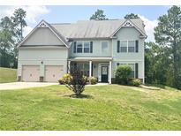 Charming two-story home with a manicured lawn, two-car garage and detailed architectural trim at 85 Clearview Ct, Sanford, NC 27332