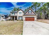 Charming two-story home featuring a two-car garage and inviting curb appeal at 202 Captain Hbr, Sanford, NC 27332