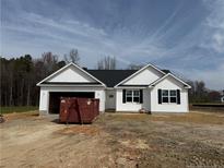 Charming single-story home with white siding and a garage, ready for personalization at 164 Jones Creek Ln, Lillington, NC 27546