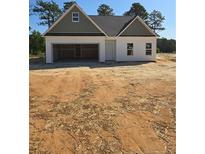 New construction home with a two-car garage and a covered front porch at 52 Blackgum Ct, Spring Lake, NC 28390