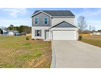 Charming two-story home featuring a two-car garage and nicely sized front lawn at 41 Aldermann (Lot 2) Ct, Dunn, NC 28334