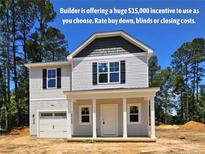 Two-story home with gray siding, black shutters and a front porch with white pillars, offering an incentive at 187 Regis Ln, Coats, NC 27521