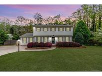 Charming two-story home with beautiful landscaping and a well-manicured lawn at 1312 Gormly Cir, Sanford, NC 27330