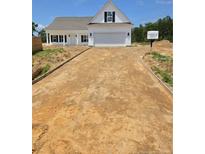 New construction home featuring white siding and a two-car garage, with a freshly laid driveway at 55 Blackgum Ct, Spring Lake, NC 28390