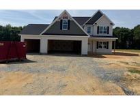 Newly constructed two story home with three-car garage awaits your personalization in a beautiful country setting at 112 Surles Landing Way, Benson, NC 27504