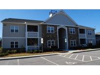 Attractive apartment complex featuring stone accents, covered balconies, and accessible parking at 291 Gallery Dr # 102, Spring Lake, NC 28390