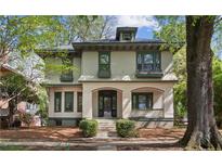 Charming two-story home with inviting front porch, dormer, mature tree, and well-maintained landscaping at 116 Hawthorne Rd, Raleigh, NC 27605