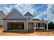 Charming new construction home featuring a spacious two-car garage and inviting front porch at 317 Harborwood St, Lillington, NC 27546