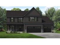New construction, two story home with dark siding and a three car garage at 65 Alder Dr, Cameron, NC 28326