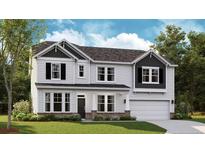 Charming two-story home with white siding, black shutters and a two car garage at 252 Steeple Ridge, Cameron, NC 28326
