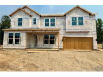 Unfinished two-story home with a two-car garage awaiting its final touches at 252 Steeple Ridge, Cameron, NC 28326