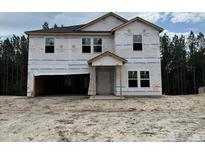 New two-story home featuring a front-entry garage in a developing community at 53 Horse Trot Ln, Sanford, NC 27332
