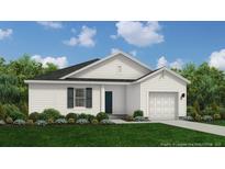 Charming single-story home featuring a white exterior, garage, lush landscaping, and a well-manicured lawn at 20 Horse Trot Ln, Sanford, NC 27332