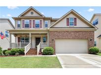 Charming two-story home featuring a welcoming front porch and attached two car garage at 508 Minerva Dale Dr, Fuquay Varina, NC 27526