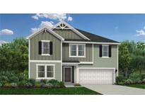 Charming two-story home features a two-car garage and a well-manicured lawn with lush landscaping at 566 Blossom Trl, Lillington, NC 27546