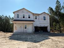 New home under construction featuring attached two car garage at 63 Horse Trot Ln, Sanford, NC 27332