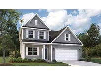 Charming two-story home with gray siding, white trim, and a two-car garage at 113 Steeple Ridge, Cameron, NC 28326
