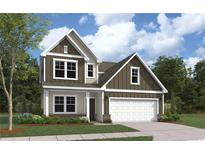 Charming two-story home with a two-car garage, neutral colors, and professionally landscaped front yard at 276 Steeple Ridge, Cameron, NC 28326