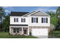 Charming two-story home featuring a two-car garage, stone accents, and classic black shutters at 664 Wilder Bloom Path, Aberdeen, NC 27526