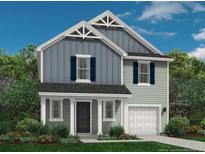 Charming two-story home with a covered porch, white trim, and blue accents against a backdrop of lush greenery at 104 Bennington Way, Lillington, NC 27546