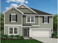 Charming two-story home with a mix of vertical and horizontal siding and an attached two-car garage at 216 Greenbay Street, Lillington, NC 27546