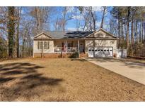 Charming single-story home with a well-maintained yard and attached two car garage at 7053 Maple Cir, Sanford, NC 27332