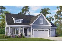 Charming single-Gathering home featuring a two-car garage, inviting front porch, and well-manicured lawn at 235 Atkins Rd, Cameron, NC 28326