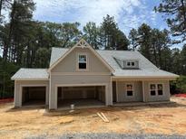 Charming new construction home features a welcoming facade and a spacious two-car garage at 2 Foxfire Blvd, Cameron, NC 27281