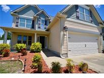 Charming two-story home featuring manicured landscaping and a two-car garage at 109 Red Coat Dr, Cameron, NC 28326