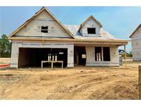 A new home under construction featuring a two car garage and contemporary architecture in a suburban neighborhood at 194 Steeple Ridge, Cameron, NC 28326