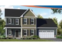 Two-story home features varied siding, black shutters, and an attached two-car garage at 215 Uwharrie Way, Sanford, NC 27330