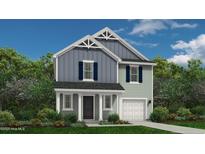 Charming two-story home boasts a covered front porch and an attached one car garage at 41 Horse Trot Ln, Sanford, NC 27332