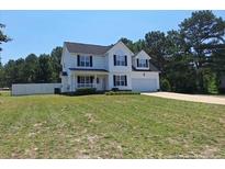 Charming two-story home with classic design and well-maintained lawn at 19 Ribbon Oak Ct, Sanford, NC 27332