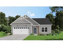 Charming single-story home with gray siding, attached garage, and well-maintained landscaping at 355 Hookbill (Lot 25) Ln, Lillington, NC 27546