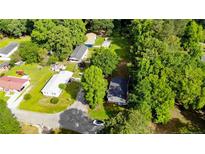 An aerial view of a quaint neighborhood with tree lined streets and well-maintained homes at 2327 Dewitt St, Sanford, NC 27330